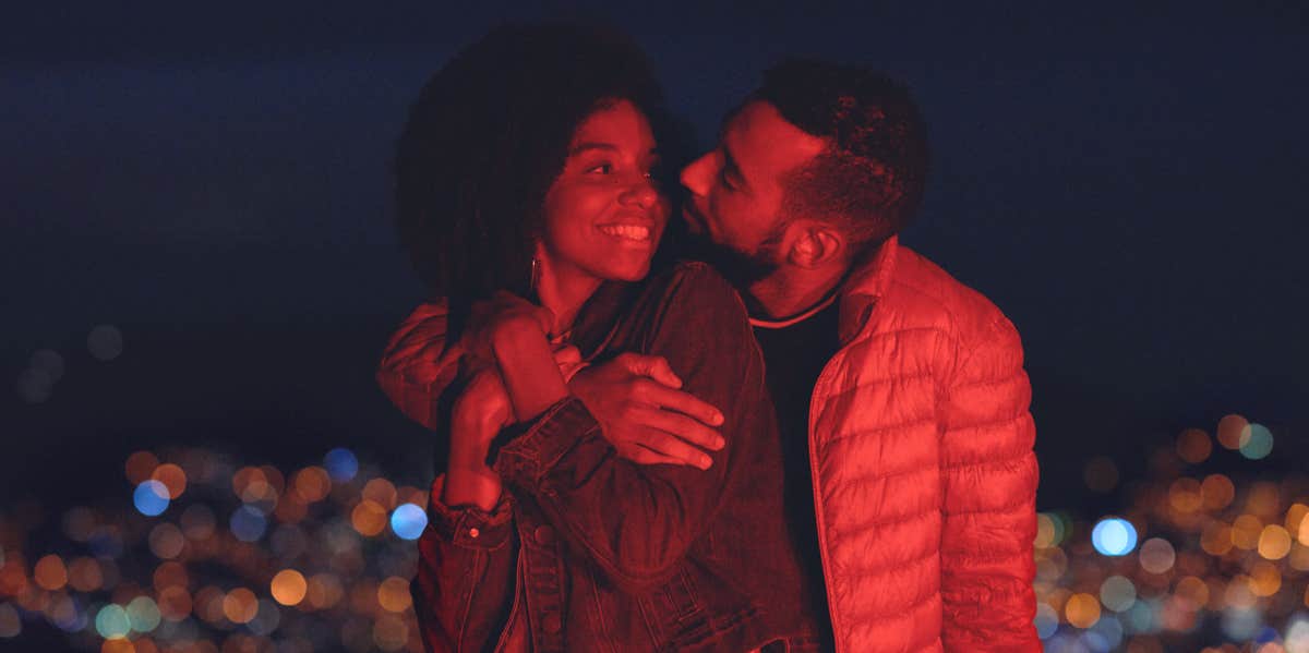 Your Strongest Zodiac Love Compatibility, Based On Your Mercury Sign couple in red glow