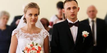 Couple Looking Unhappy At Wedding While Woman Shares The Hot Take On Marriage She Got From A Divorce Lawyer